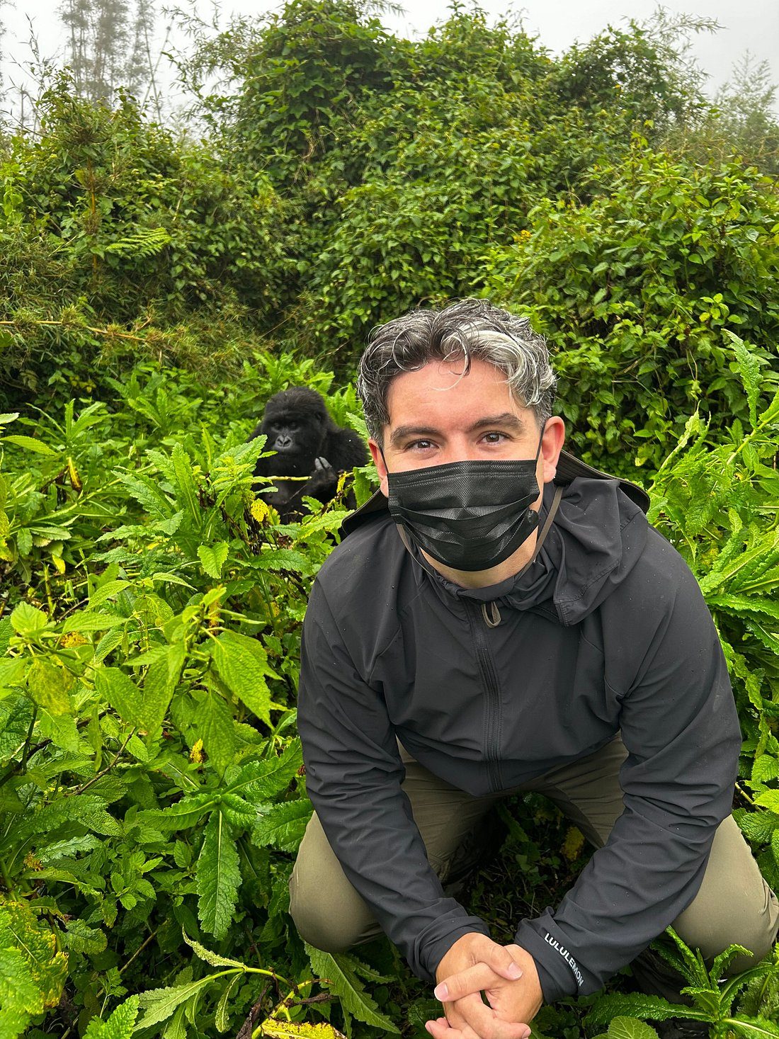 Formula 1: Top Tourist Activities in Rwanda | Universal Ventures Rwanda Man wearing a black mask crouching in dense green vegetation with a black gorilla visible in the background, mountain gorilla trekking in africa, Rwanda Luxury Safaris, High-end gorilla Trekking Safaris, Rwanda gorilla tours, mountain gorilla trekking tours, Volcanoes National Park tours, Rwanda gorilla safari packages, gorilla permits Rwanda, best time for gorilla trekking in Rwanda, Rwanda primate safaris, golden monkey tracking Rwanda, gorilla trekking holidays, Rwanda gorilla trekking cost, mountain gorilla safari Africa, Musanze Rwanda tours, Dian Fossey Gorilla Fund visit, Rwanda conservation tourism, responsible gorilla trekking, Akagera National Park safari, Rwanda Big Five safari, Rwanda wildlife tour packages, African wildlife safari Rwanda, Akagera game drives, Akagera boat safari, Lake Ihema boat trip, Rwanda birdwatching tours, Rwanda safari holidays, Rwanda safari itinerary, Rwanda national parks, Rwanda animal safaris, leopard sightings in Akagera, Rwanda elephant safari, Rwanda rhino safari, Nyungwe Forest National Park, chimpanzee trekking Rwanda, Nyungwe canopy walkway, Rwanda forest hiking tours, Gishwati-Mukura National Park tours, Rwanda nature walks, Rwanda birding holidays, Mount Bisoke hiking, Rwanda volcano hiking, Congo Nile Trail Rwanda, Rwanda mountain biking, Rwanda waterfall hikes, Rwanda eco tours, Rwanda nature photography, Rwanda outdoor adventures, Kigali city tours, things to do in Kigali, Rwanda cultural tours, Rwandan cultural experiences, Rwanda coffee tours, Rwanda food tours, Rwanda local markets, Kigali Genocide Memorial visit, Lake Kivu holidays, Lake Kivu boat trips, Rubavu Rwanda tourism, Karongi travel experiences, Rwanda village tours, Rwanda art and craft tours, Rwanda community-based tourismRwanda Grand Prix, Formula 1 African Grand Prix, Rwanda F1 Grand Prix, Formula One Rwanda, Rwanda Formula One race, F1 Grand Prix Rwanda, Formula 1 race in Rwanda, Bugesera F1 circuit, Rwanda motorsport tourism, Rwanda Grand Prix travel packages, Rwanda F1 tickets, Rwanda Grand Prix hotels, Rwanda race weekend, F1 tourism in Africa, Formula 1 African Grand Prix tourism, luxury Rwanda safari, Rwanda luxury tours, Rwanda honeymoon safari, Rwanda family safari holidays, Rwanda private safari, Rwanda photographic safari, Rwanda eco lodge holidays, Rwanda luxury gorilla trekking, Rwanda weekend getaways, Rwanda business travel, Rwanda conference tourism, Rwanda tailor-made tours, Rwanda small group tours, Rwanda all-inclusive safari, Rwanda premium travel experiences, best time to visit Rwanda, Rwanda safari prices, Rwanda travel costs, Rwanda tour operator, Rwanda safari booking, Rwanda travel advice, Rwanda visa requirements, Rwanda safari lodges, Rwanda accommodation guide, Rwanda transport for tourists, Rwanda airport transfers, East Africa safari packages, Rwanda Uganda safari, Rwanda Kenya Tanzania safari, sustainable tourism Rwanda